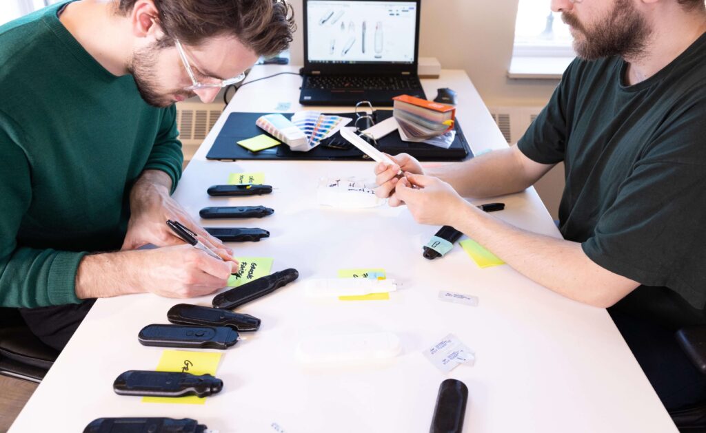 Two industrial designers working on prototypes.